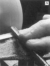 A spindle gouge sharpened to an extremely sharp point is ideal to cut the V grooves in surface of this turned box.