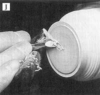 With the lid glued to a waste block, refine the lid interior with a long point of a skew.